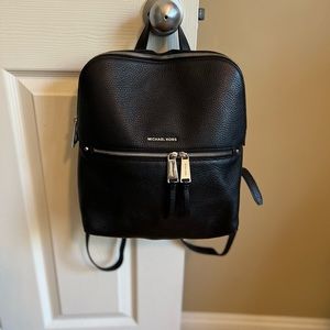 Michael Kors Black leather backpack purse. Used in great condition.
